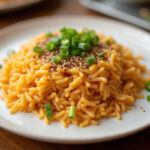 Delicious and colorful Arroz Tres Delicias served on a plate, perfect for any meal.