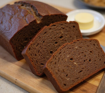 Finished Pan De Centeno loaf, perfect for sandwiches and enjoying the ultimate rye bread experience.