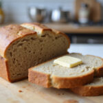 Delicious sliced and buttered modern spelt bread, ready to serve.