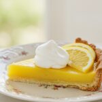 Delicious pay de limón dessert slice with fresh toppings, perfect for any occasion.