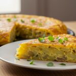 Slice of tortilla española ligera on a plate, ideal for a healthy meal.