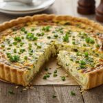 Finished quiche fácil garnished with herbs, perfect for any meal.