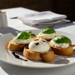 Delicious bruschetta con burrata served beautifully, an entree gourmet option for any occasion.