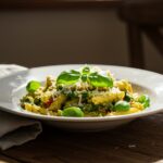 Finished pasta de verduras with fresh herbs and cheese, ready to enjoy.