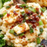 A vibrant plate of arroz con verduras y queso crema featuring colorful diced vegetables atop fluffy, golden rice, drizzled with a creamy cheese sauce and garnished with fresh herbs.